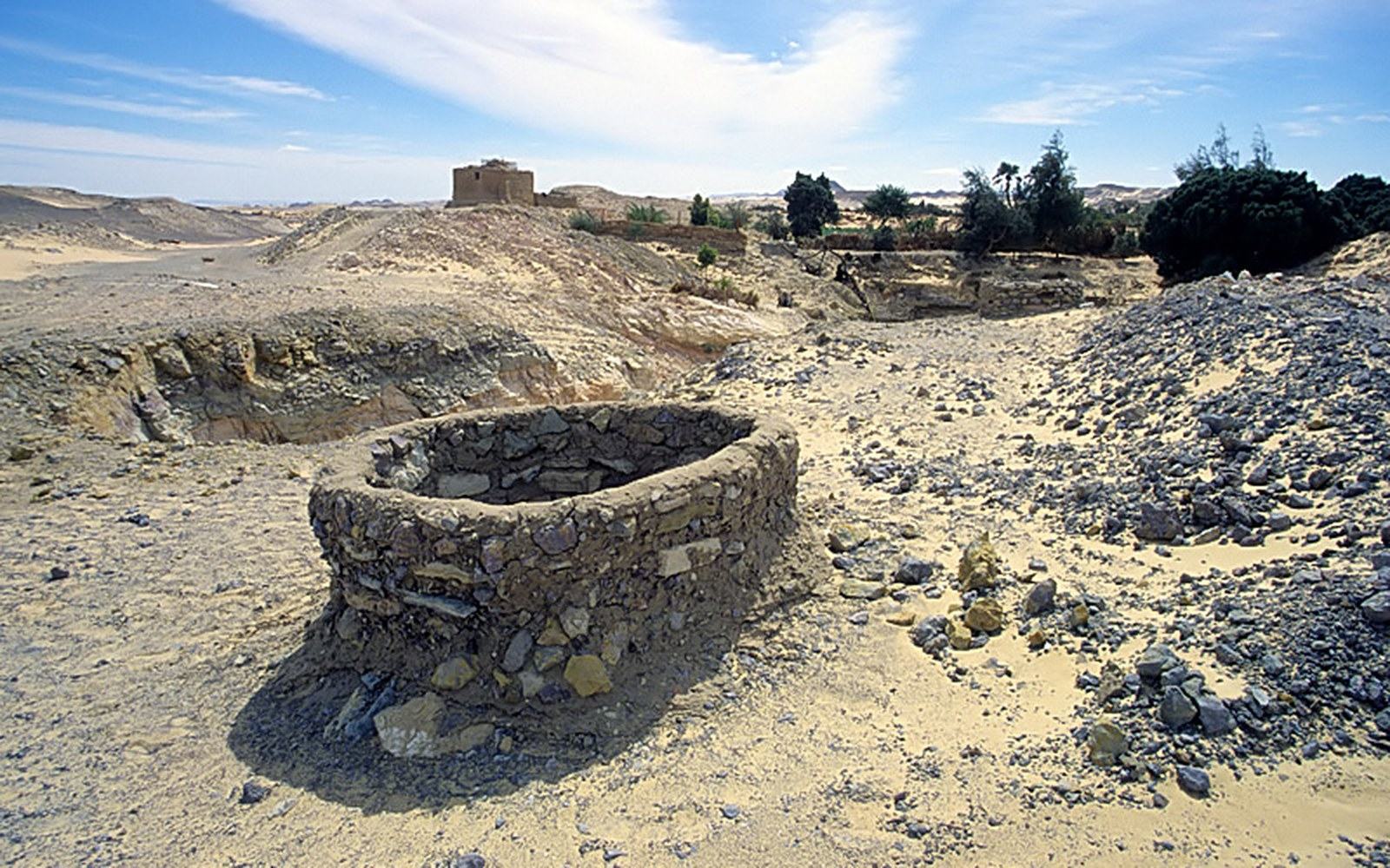 The spoil-rings of qanat shafts running in a line across dry ground